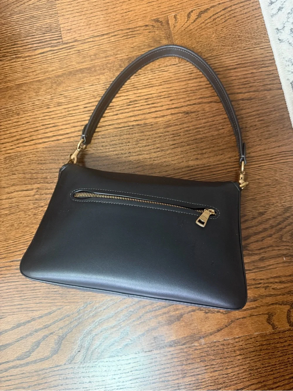 Coach Black Leather Shoulder Bag with Gold 'C' Accent
